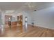 Open layout living room with view of updated kitchen featuring wooden cabinets and stainless appliances at 8521 Caitlin Ct, Hudson, FL 34667