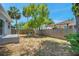 Fenced backyard with a patio, seating, and ample space for outdoor activities and entertaining at 8608 N Arden Ave, Tampa, FL 33604