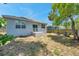 Charming backyard with a cozy patio and seating area, perfect for enjoying the outdoors at 8608 N Arden Ave, Tampa, FL 33604