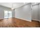 Large dining room with wood-look tile flooring and sliding door access at 8608 N Arden Ave, Tampa, FL 33604