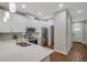 Modern kitchen features stainless appliances, quartz counters, and white cabinets at 8608 N Arden Ave, Tampa, FL 33604