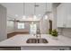 Open kitchen showcases quartz counters and stainless steel appliances at 8608 N Arden Ave, Tampa, FL 33604