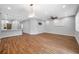 Open-concept living space with kitchen island and modern ceiling fan at 8608 N Arden Ave, Tampa, FL 33604