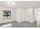 This bedroom has a bright window and hardwood floors at 9266 Century Dr, Spring Hill, FL 34606