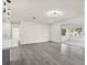 Spacious living area featuring gray flooring, recessed lighting, and open concept living at 9266 Century Dr, Spring Hill, FL 34606