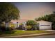 Beautiful single Gathering home with a two car garage, mature landscaping and a lovely manicured lawn at 970 Ridgewood Ter, Tarpon Springs, FL 34689