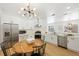 Bright, updated kitchen featuring white cabinets, stainless steel appliances, and an eat-in dining area at 970 Ridgewood Ter, Tarpon Springs, FL 34689