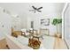 Inviting living room featuring neutral decor, light-colored flooring, and an abundance of natural light at 970 Ridgewood Ter, Tarpon Springs, FL 34689