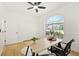 Office features a large window with front yard view and hardwood floors at 970 Ridgewood Ter, Tarpon Springs, FL 34689