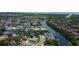 Aerial view of a waterfront community with beautiful homes, private docks, and easy access to the open water at 10744 Drummond Rd, Tampa, FL 33615