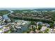 Aerial view of a waterfront community, showing canal access, well-manicured lawns, and mature landscaping at 10744 Drummond Rd, Tampa, FL 33615