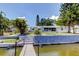 Waterfront house with a well-maintained backyard, private dock, and access to the open water at 10744 Drummond Rd, Tampa, FL 33615