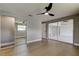 Bright bedroom offers a contemporary fan, mirrored closet, and easy access to additional spaces through a hallway at 10744 Drummond Rd, Tampa, FL 33615