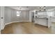 Inviting living space with recessed lighting seamlessly transitioning into the modern kitchen at 10744 Drummond Rd, Tampa, FL 33615