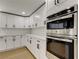 Close up of new stainless steel appliances and white cabinets in a remodeled kitchen at 10744 Drummond Rd, Tampa, FL 33615