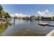 View showcasing the canal waterfront, homes, docks, and boats adding charm to the community at 10744 Drummond Rd, Tampa, FL 33615