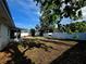 Spacious backyard featuring a patio area, grill, and new fence, ideal for outdoor gatherings at 11735 86Th Ave, Seminole, FL 33772