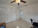 Bedroom features natural lighting, a ceiling fan, neutral walls, and closet at 11735 86Th Ave, Seminole, FL 33772