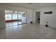 Spacious living room featuring tile flooring and access to an enclosed sunroom, perfect for relaxation at 11735 86Th Ave, Seminole, FL 33772