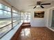 Relaxing sunroom featuring tile flooring, a wall of windows, and backyard view, perfect for tranquil enjoyment at 11735 86Th Ave, Seminole, FL 33772