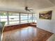 Bright sunroom with tiled floors, large windows, and a cozy brick bench, ideal for relaxing or entertaining at 11735 86Th Ave, Seminole, FL 33772
