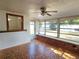Beautiful sunroom featuring tiled flooring, plenty of natural light, and backyard access for seamless indoor-outdoor living at 11735 86Th Ave, Seminole, FL 33772