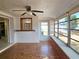 Charming sunroom with lots of natural light, tile flooring, and access to the backyard, great for outdoor living at 11735 86Th Ave, Seminole, FL 33772