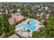 Aerial view of a community pool, surrounded by lush landscaping and well-maintained buildings at 11901 4Th N St # 5111, St Petersburg, FL 33716