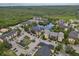 Expansive aerial view of the community near a vast wooded area, pond and lush natural surroundings at 11901 4Th N St # 5111, St Petersburg, FL 33716
