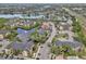 Aerial view of the condos situated on the water in a community with mature landscaping and nearby highway at 11901 4Th N St # 5111, St Petersburg, FL 33716