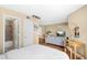 Spacious bedroom featuring an attached bathroom and adjacent living area, blending comfort and convenience at 11901 4Th N St # 5111, St Petersburg, FL 33716
