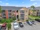 Exterior view of a multi-story building with ample parking and well-manicured landscaping at 11901 4Th N St # 5111, St Petersburg, FL 33716