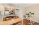 Cozy dining area featuring a table with chairs, an adjacent kitchen, and a functional workspace at 11901 4Th N St # 5111, St Petersburg, FL 33716