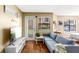 Bright living room with a comfortable blue sofa and a mounted television for relaxing entertainment at 11901 4Th N St # 5111, St Petersburg, FL 33716