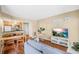 Bright living room with wood floors, neutral paint, and an open layout to the kitchen at 11901 4Th N St # 5111, St Petersburg, FL 33716