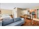 Open-concept living space with a sofa, dining area, and efficient kitchen, perfect for modern living at 11901 4Th N St # 5111, St Petersburg, FL 33716