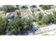 Aerial view of the property showcasing the layout, roof, yard, and surrounding neighborhood at 12136 Luftburrow Ln, Hudson, FL 34669