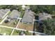 Aerial view of a single-Gathering home with fenced-in yard, patio, and mature trees at 12136 Luftburrow Ln, Hudson, FL 34669