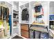 Spacious walk-in closet featuring built-in shelving and ample storage for clothes and accessories at 12136 Luftburrow Ln, Hudson, FL 34669
