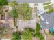Aerial view of the property showcasing the roof, landscaping, and surrounding neighborhood at 1228 Rainbrook Cir, Valrico, FL 33596