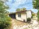 Exterior side view of the house with a screened-in porch and lush backyard at 1228 Rainbrook Cir, Valrico, FL 33596