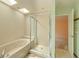This bathroom features a skylight, a bathtub, and glass enclosed shower at 1228 Rainbrook Cir, Valrico, FL 33596