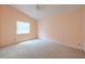 This bedroom features a ceiling fan, a vaulted ceiling and light peach colored walls at 1228 Rainbrook Cir, Valrico, FL 33596