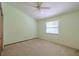 Comfortable bedroom featuring a window, fan, and a closet at 1228 Rainbrook Cir, Valrico, FL 33596