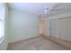 Bright bedroom with large closet, neutral color paint and ceiling fan at 1228 Rainbrook Cir, Valrico, FL 33596