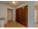 Welcoming entryway featuring tiled flooring and a pair of solid wood double doors at 1228 Rainbrook Cir, Valrico, FL 33596