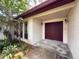 Inviting front entrance with double doors, sidelight windows and mature landscaping at 1228 Rainbrook Cir, Valrico, FL 33596