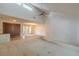 Spacious living room featuring high ceilings, tiled entryway, and a ceiling fan at 1228 Rainbrook Cir, Valrico, FL 33596
