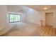 Bright living room with high ceilings, and sliding doors leading to outdoor area at 1228 Rainbrook Cir, Valrico, FL 33596