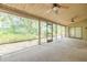 Spacious screened porch features ceiling fans and views of the landscaped backyard at 1228 Rainbrook Cir, Valrico, FL 33596